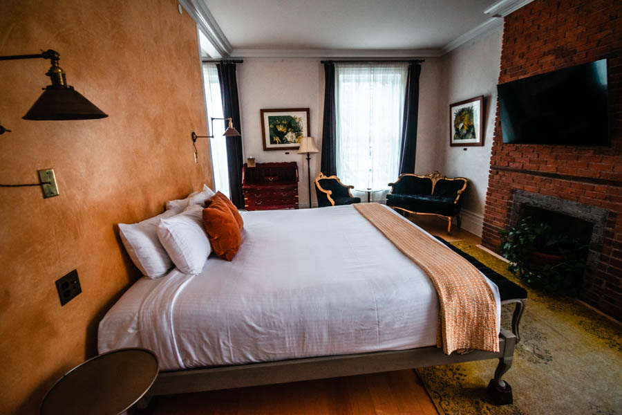 A bed in a room at Argos Inn, a boutique hotel in Ithaca, NY