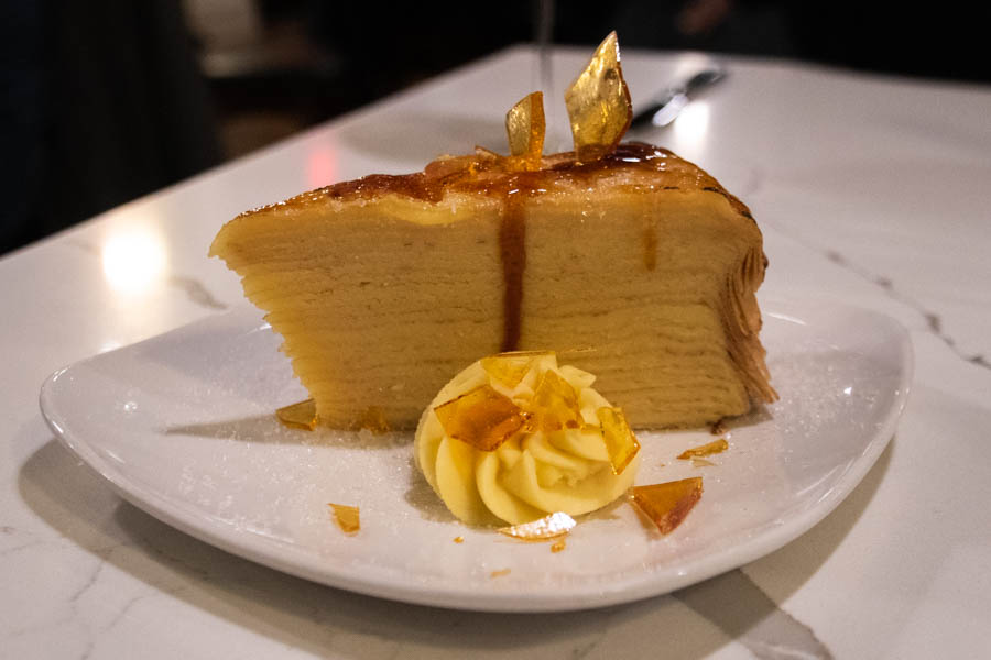 Elegant Mille Crepe Cake for Dessert – A beautifully layered crepe cake topped with caramelized sugar, a sweet treat to end a perfect day.